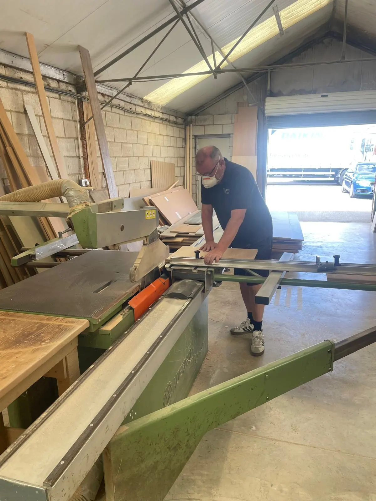 Paul Nelson cutting a panel on the Altendorf panel saw in the Littlehampton workshop