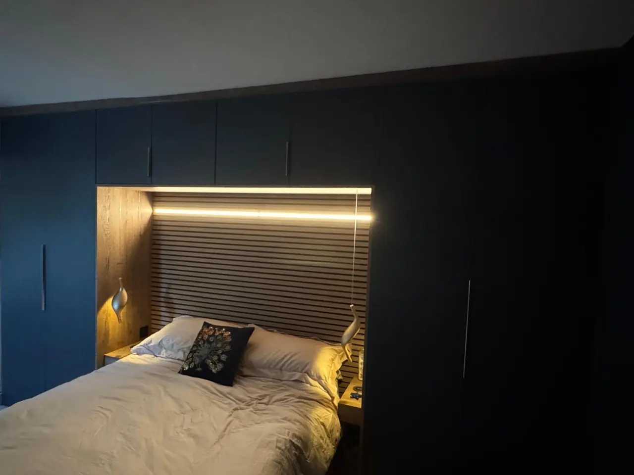 Bedroom navy fitted wardrobe bed nook LED strip, made and fitted by Sussex Design Interiors