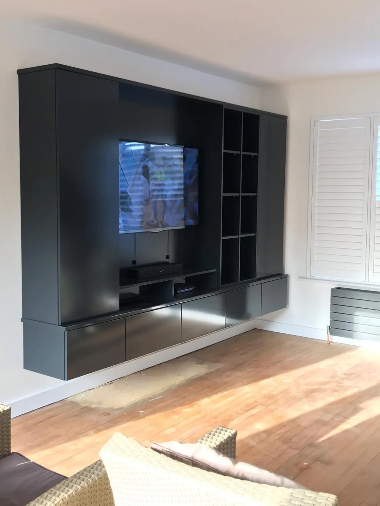Floating TV media unit black, made and fitted by Sussex Design Interiors