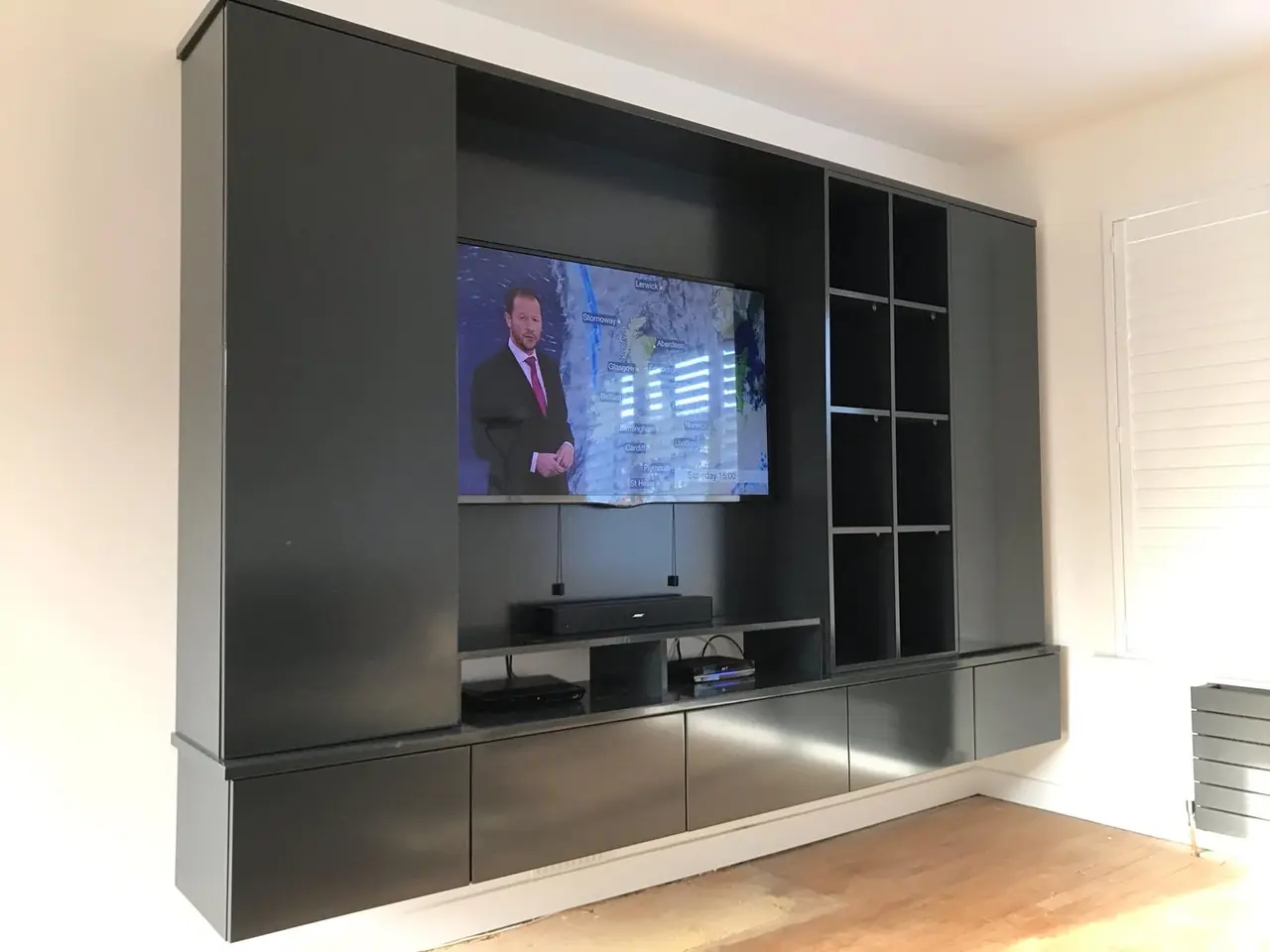 Floating TV media unit black, made and fitted by Sussex Design Interiors