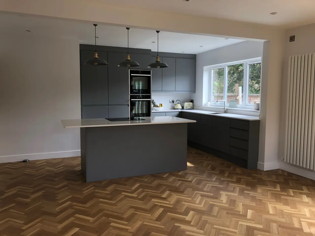 Kitchen anthracite herringbone floor pendant lights, made and fitted by Sussex Design Interiors