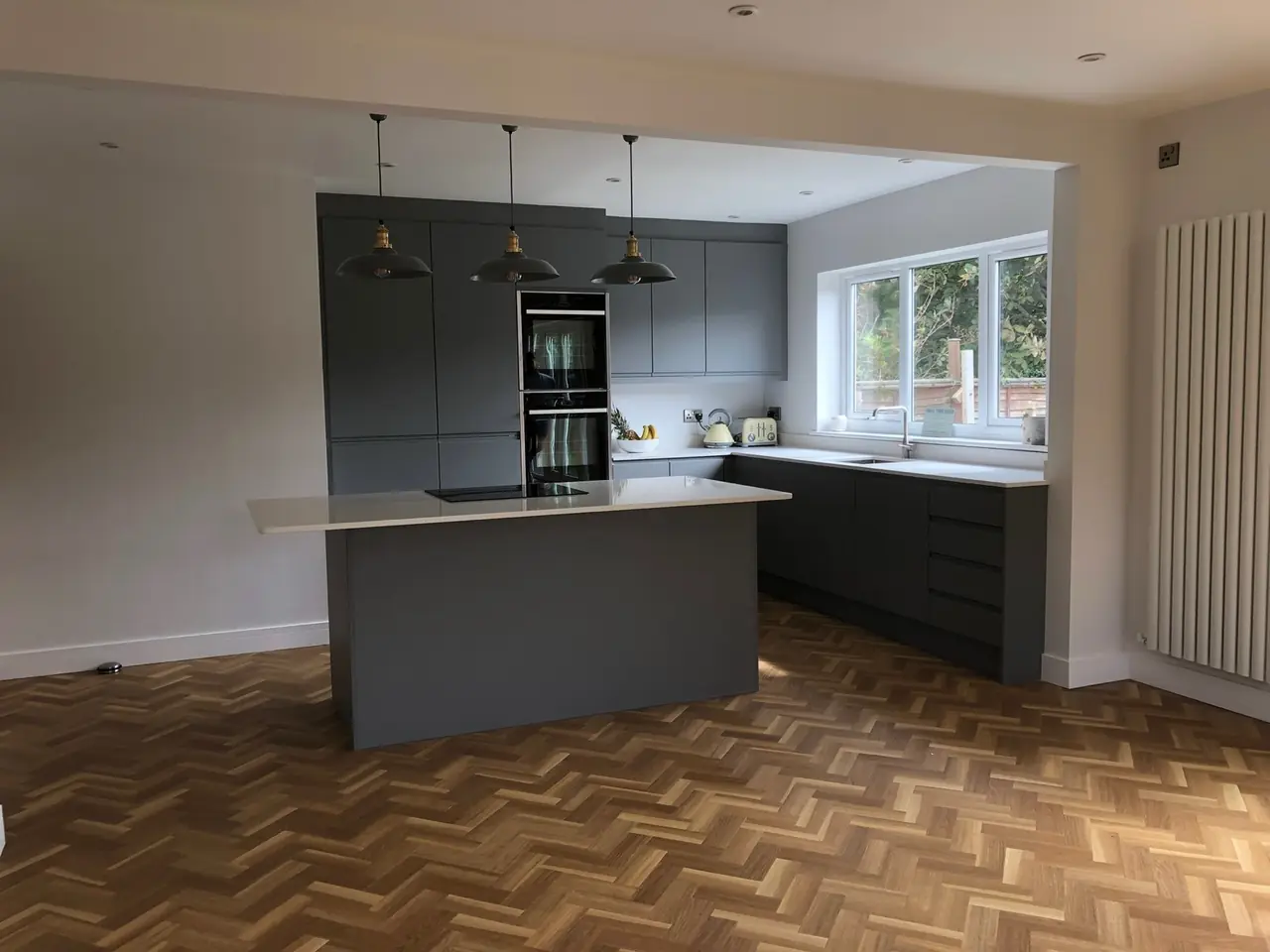 Kitchen anthracite herringbone floor pendant lights, made and fitted by Sussex Design Interiors