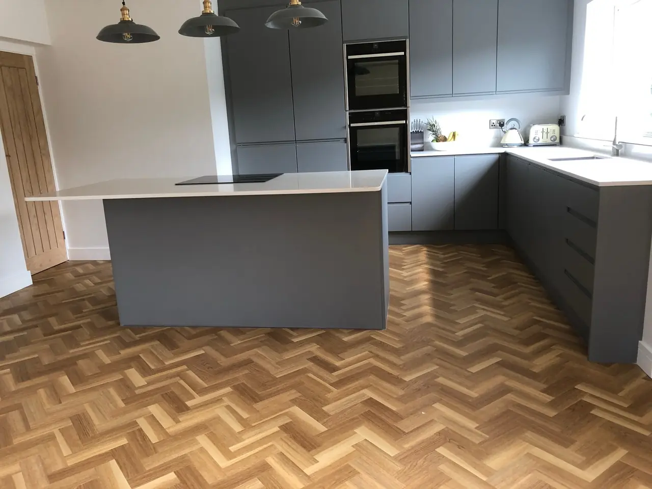 Kitchen anthracite herringbone floor window, made and fitted by Sussex Design Interiors