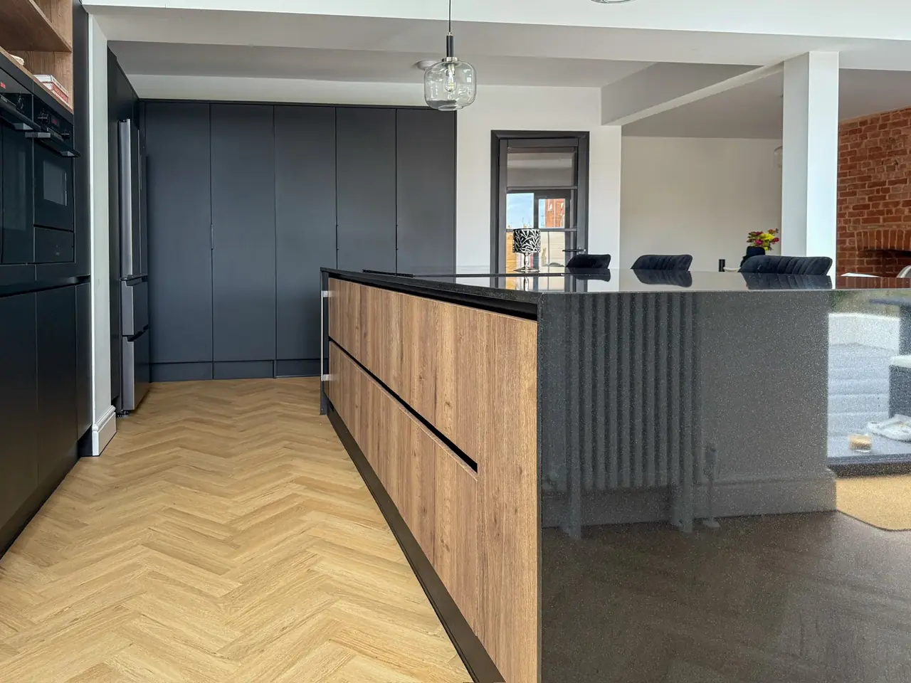 Kitchen black oak island herringbone floor radiator, made and fitted by Sussex Design Interiors
