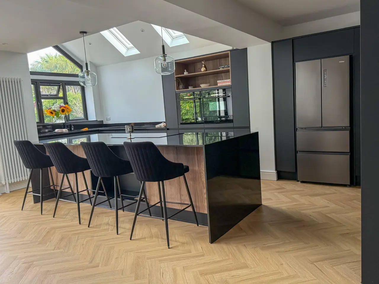 Kitchen black oak island skylight fridge freezer, made and fitted by Sussex Design Interiors