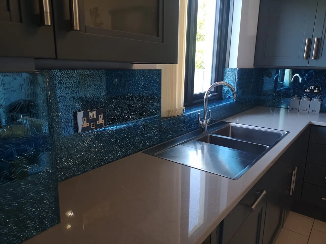 Kitchen blue glass mosaic splashback sink window, made and fitted by Sussex Design Interiors