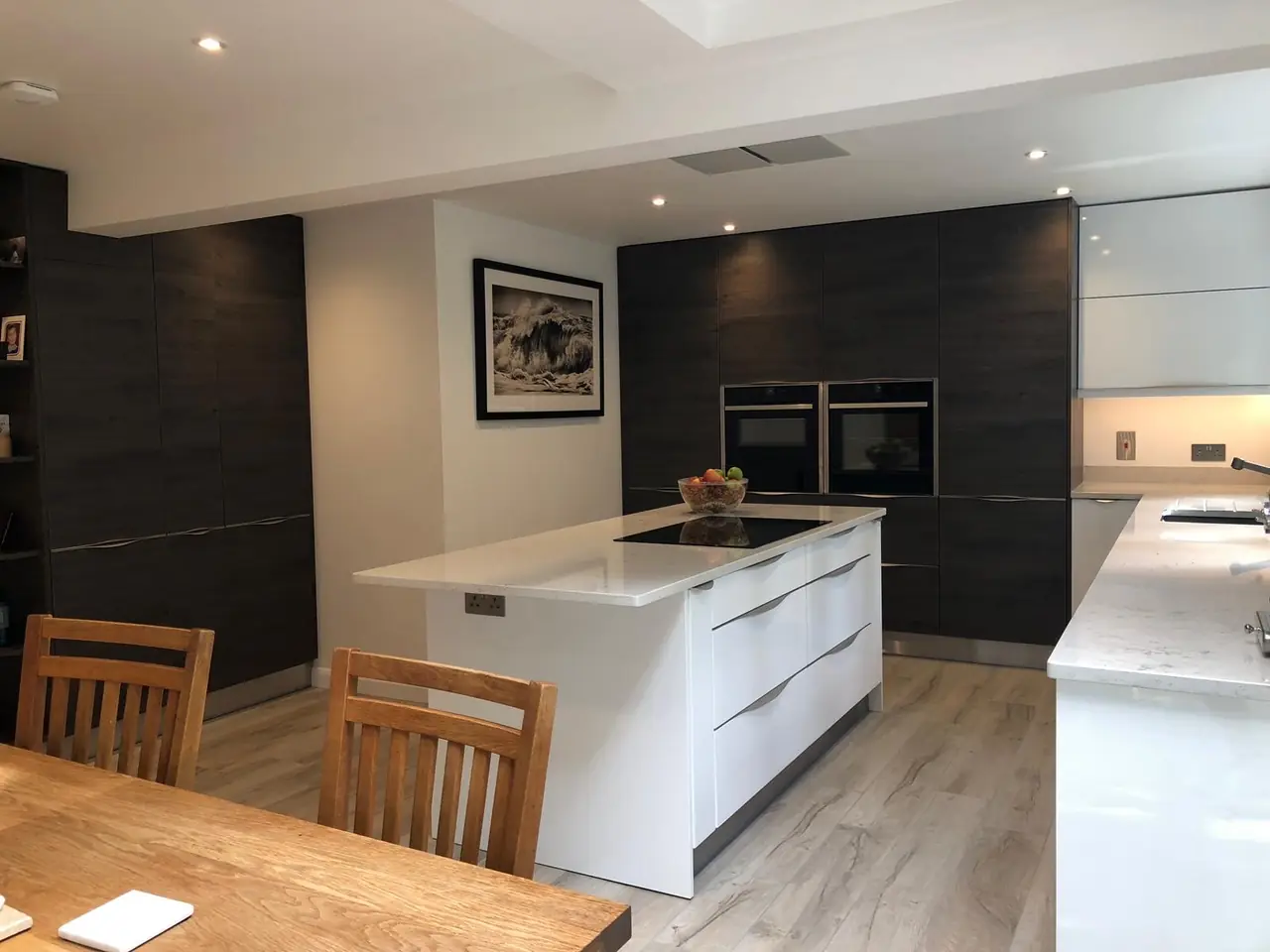 Kitchen dark wood white island dining table, made and fitted by Sussex Design Interiors