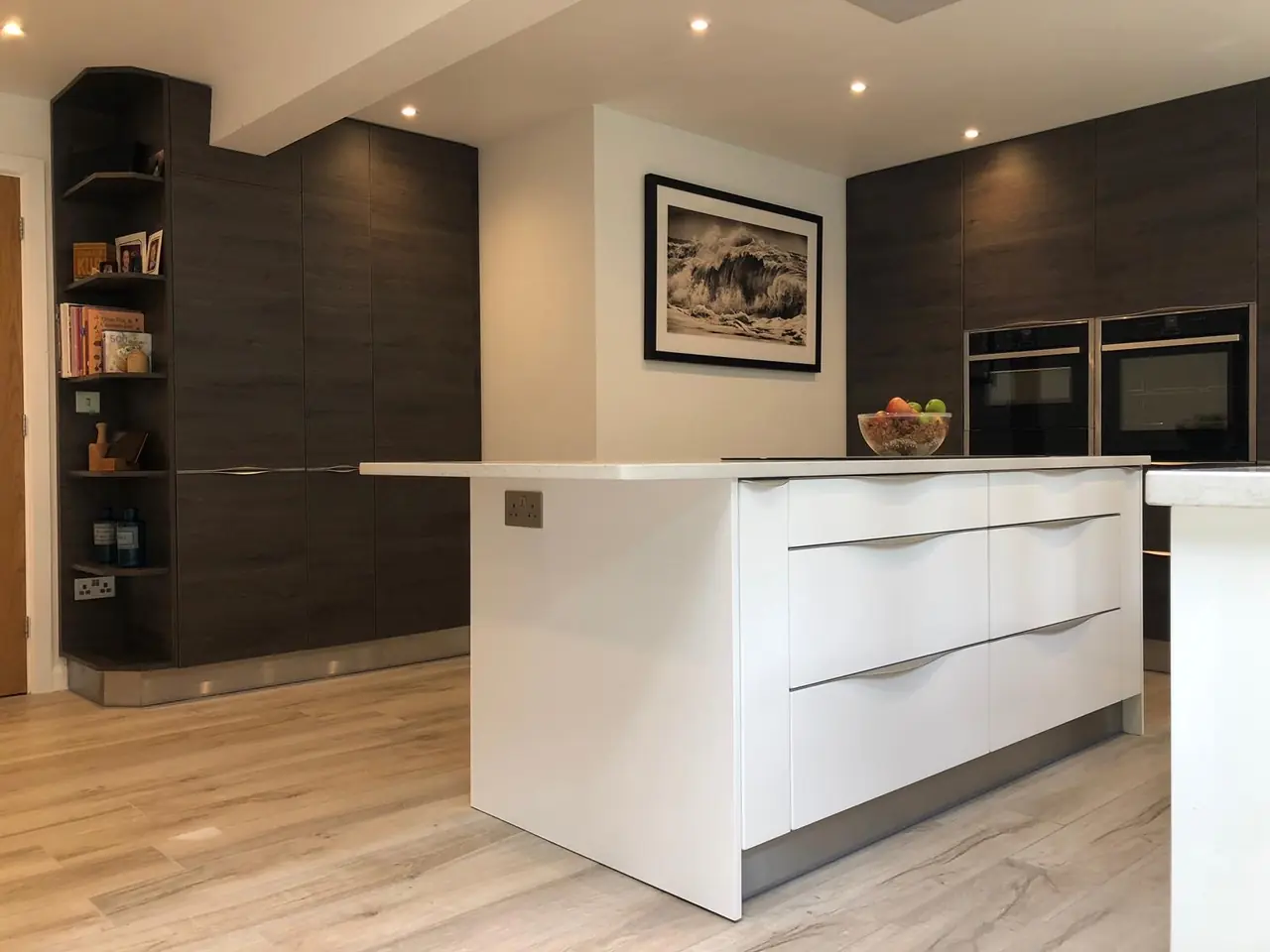 Kitchen dark wood white island framed print, made and fitted by Sussex Design Interiors
