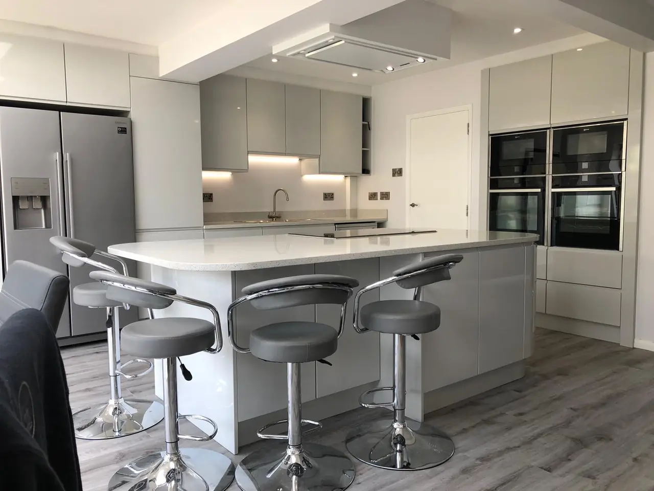 Kitchen grey gloss island fridge freezer, made and fitted by Sussex Design Interiors