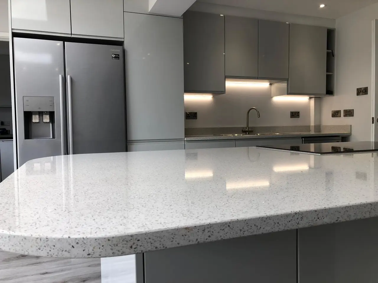 Kitchen grey gloss terrazzo countertop close-up, made and fitted by Sussex Design Interiors