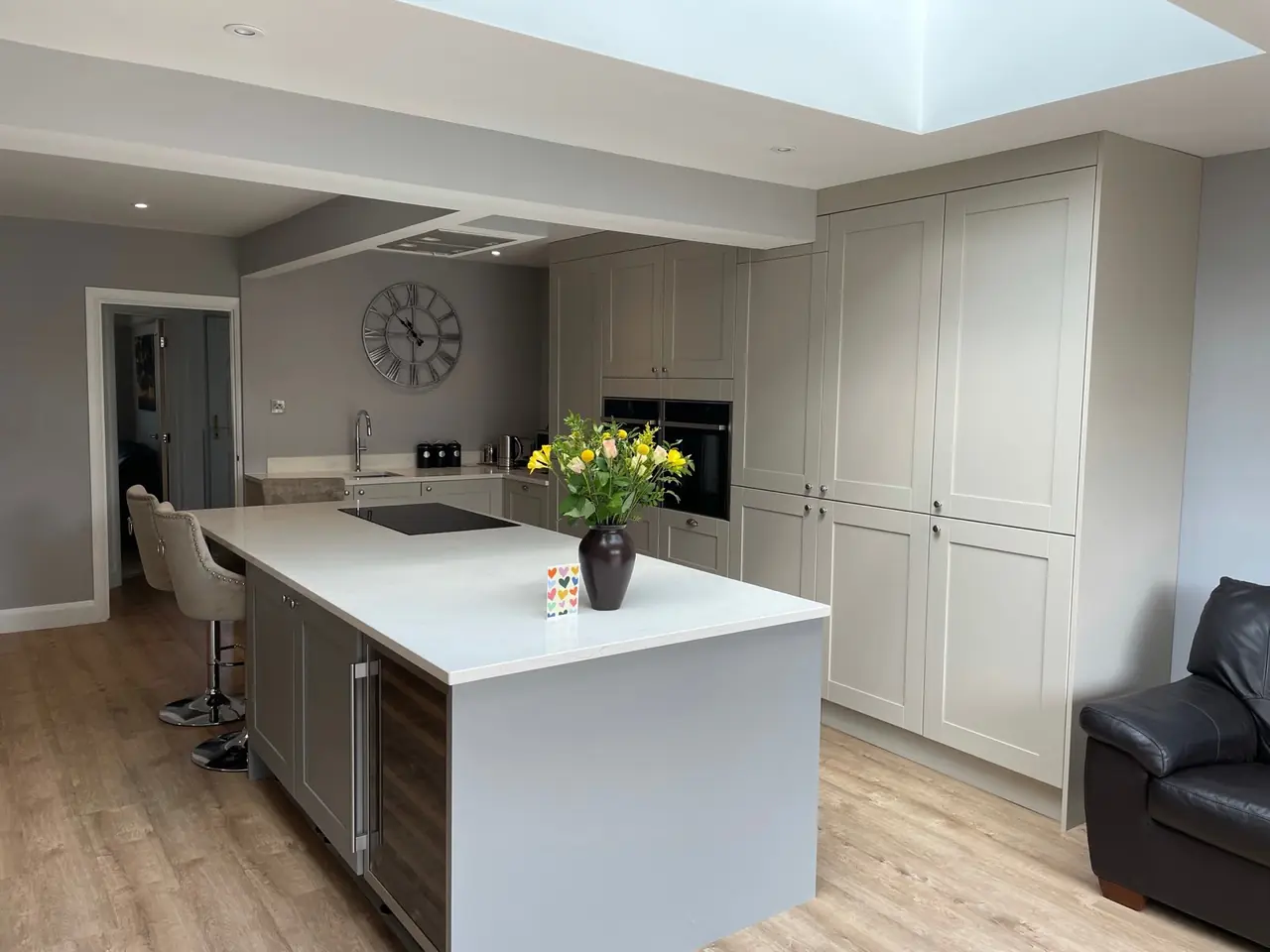 Kitchen grey shaker island skylight wall clock, made and fitted by Sussex Design Interiors