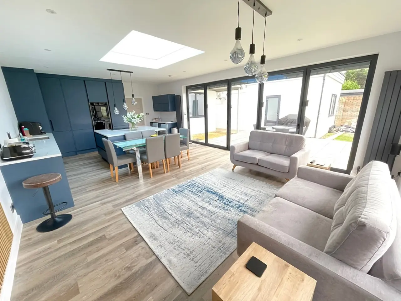 Kitchen navy blue open plan living dining, made and fitted by Sussex Design Interiors