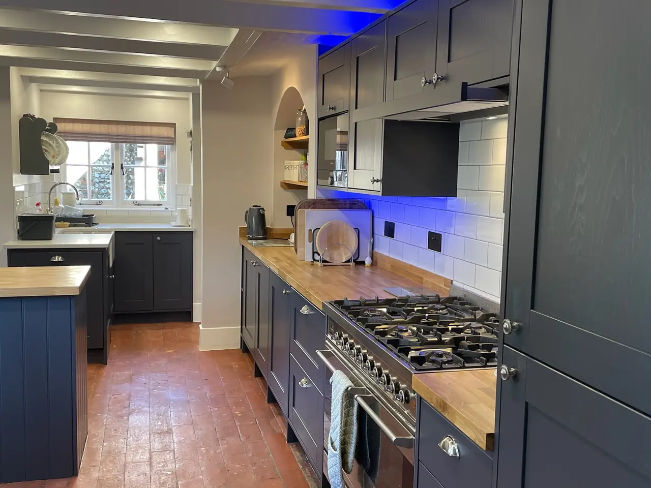 Kitchen navy shaker arched pantry hallway, made and fitted by Sussex Design Interiors