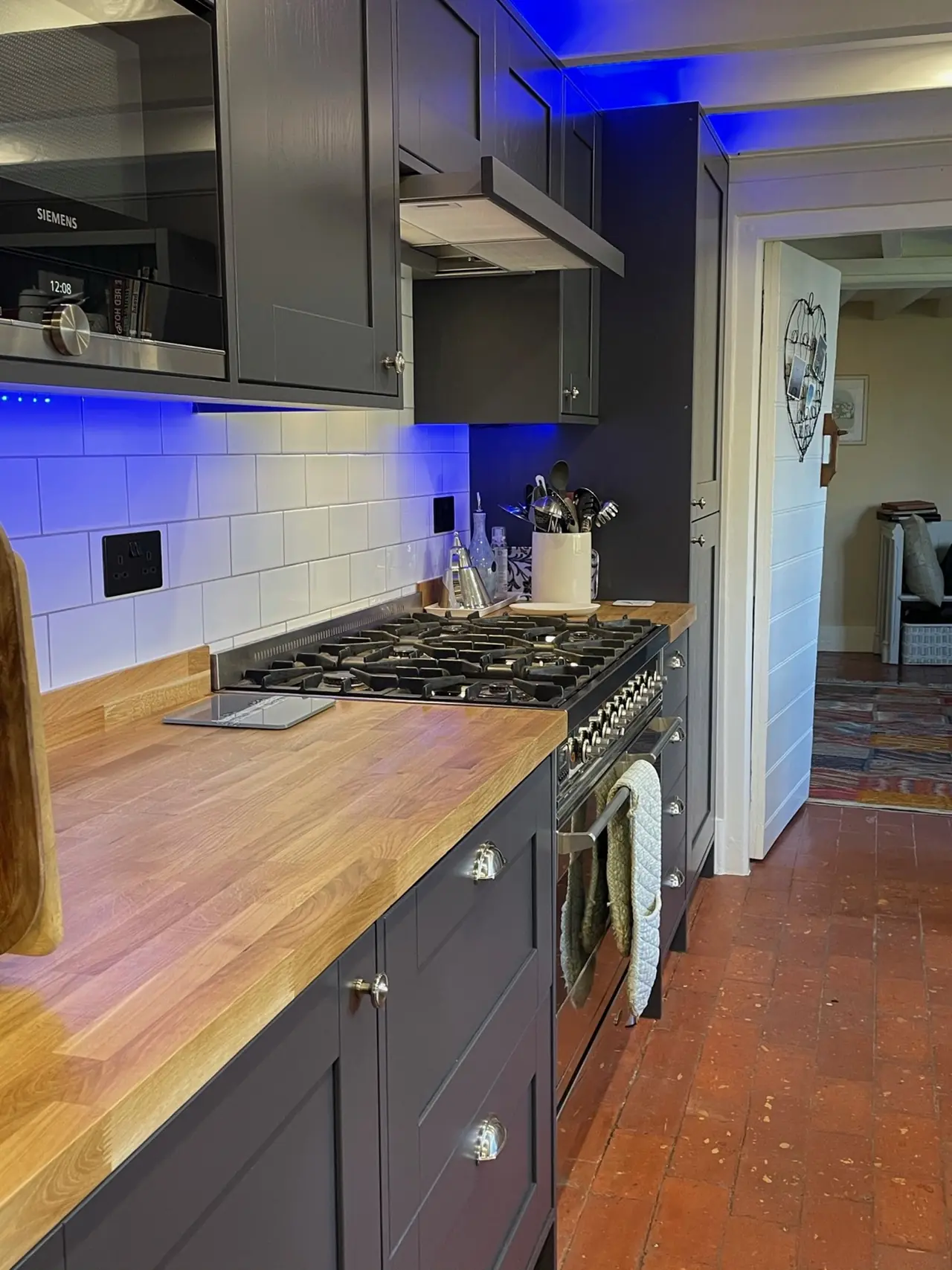 Kitchen navy shaker open shelving blue LED, made and fitted by Sussex Design Interiors