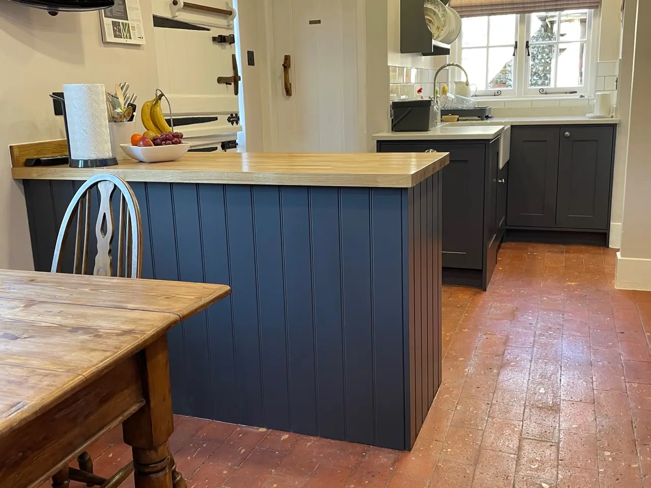Kitchen navy shaker open shelving oak worktop, made and fitted by Sussex Design Interiors