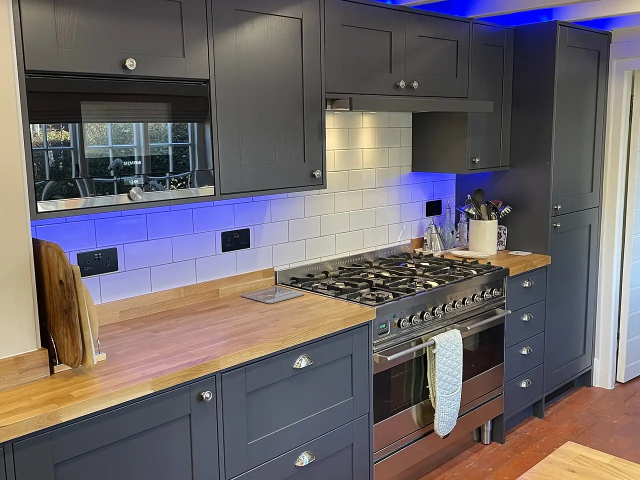 Kitchen navy shaker range cooker blue LED, made and fitted by Sussex Design Interiors