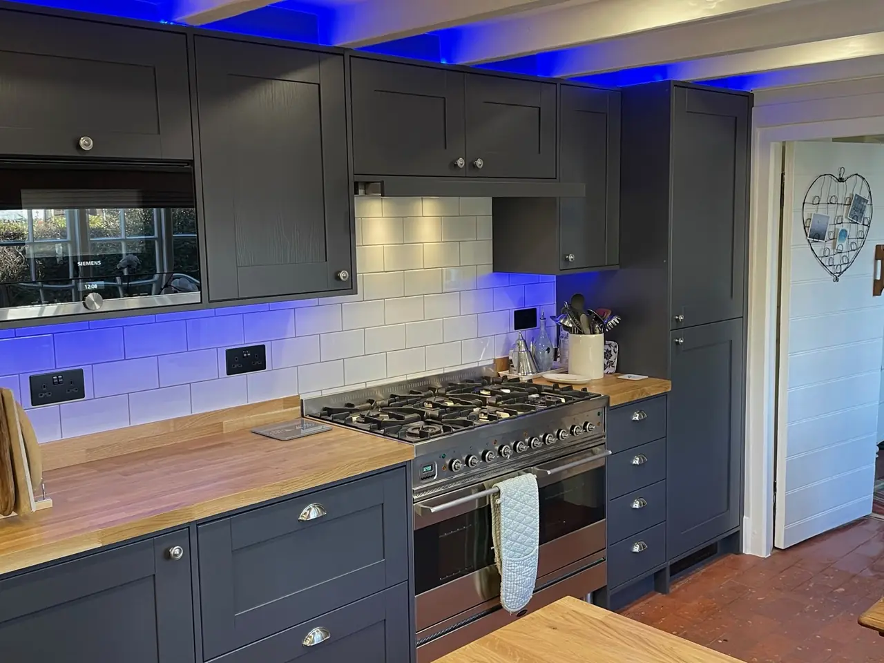 Kitchen navy shaker range cooker blue LED heart sign, made and fitted by Sussex Design Interiors