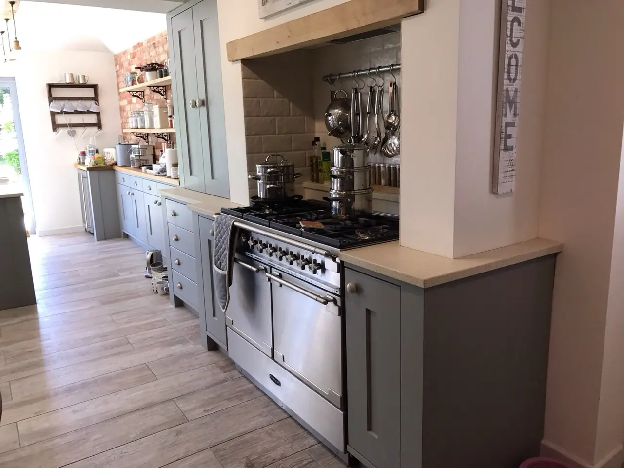 Kitchen shaker grey range cooker brick wall, made and fitted by Sussex Design Interiors