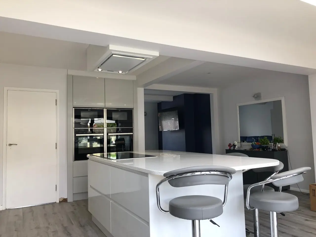 Kitchen white gloss grey bar stools, made and fitted by Sussex Design Interiors