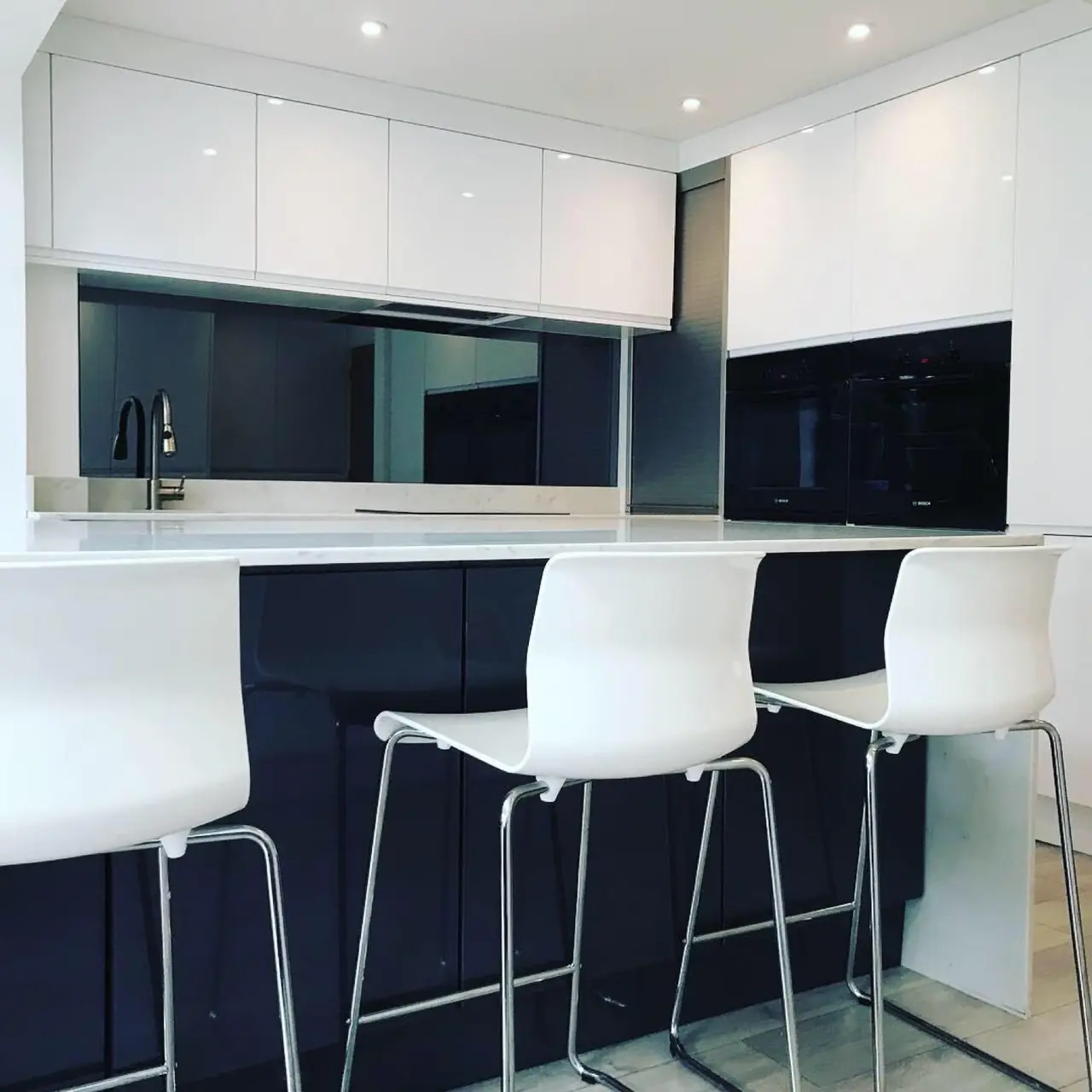 Kitchen white gloss navy island bar stools, made and fitted by Sussex Design Interiors
