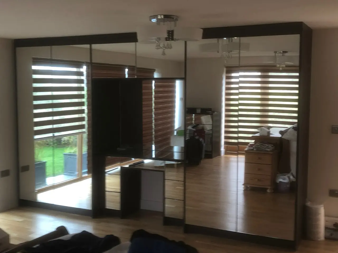 Mirrored wardrobe sliding doors bedroom, made and fitted by Sussex Design Interiors
