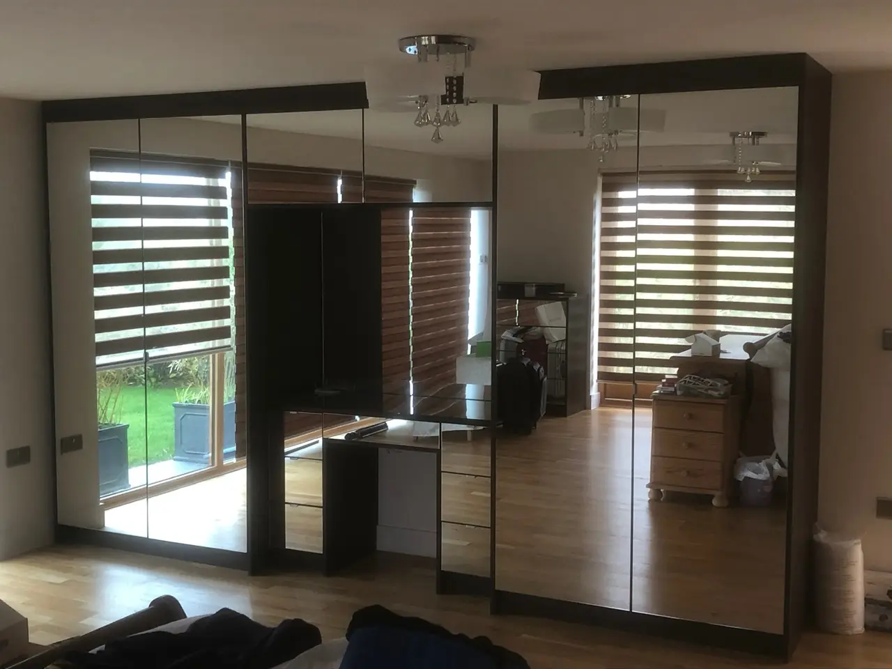 Mirrored wardrobe sliding doors bedroom, made and fitted by Sussex Design Interiors