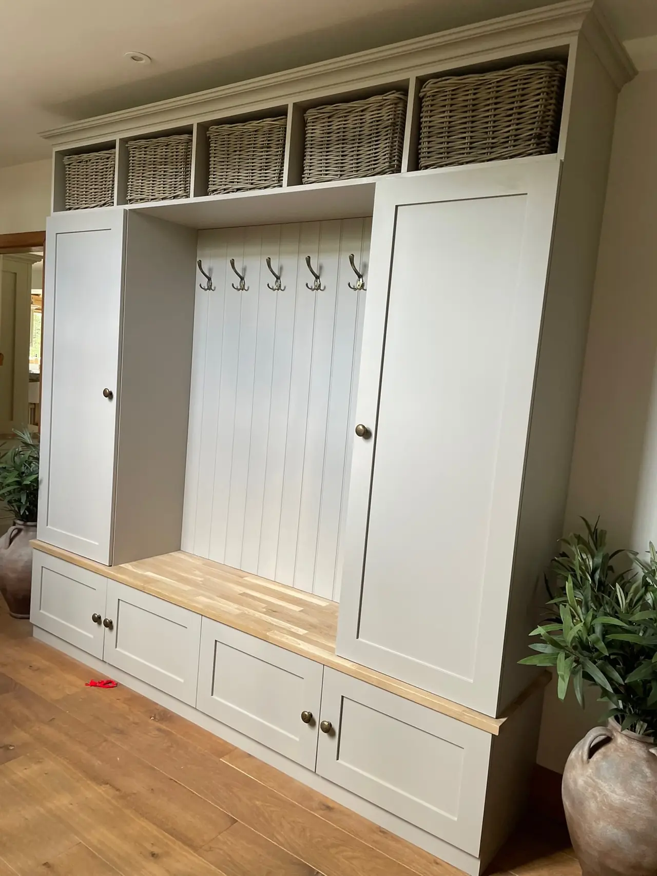 Mudroom bench hooks wicker baskets, made and fitted by Sussex Design Interiors