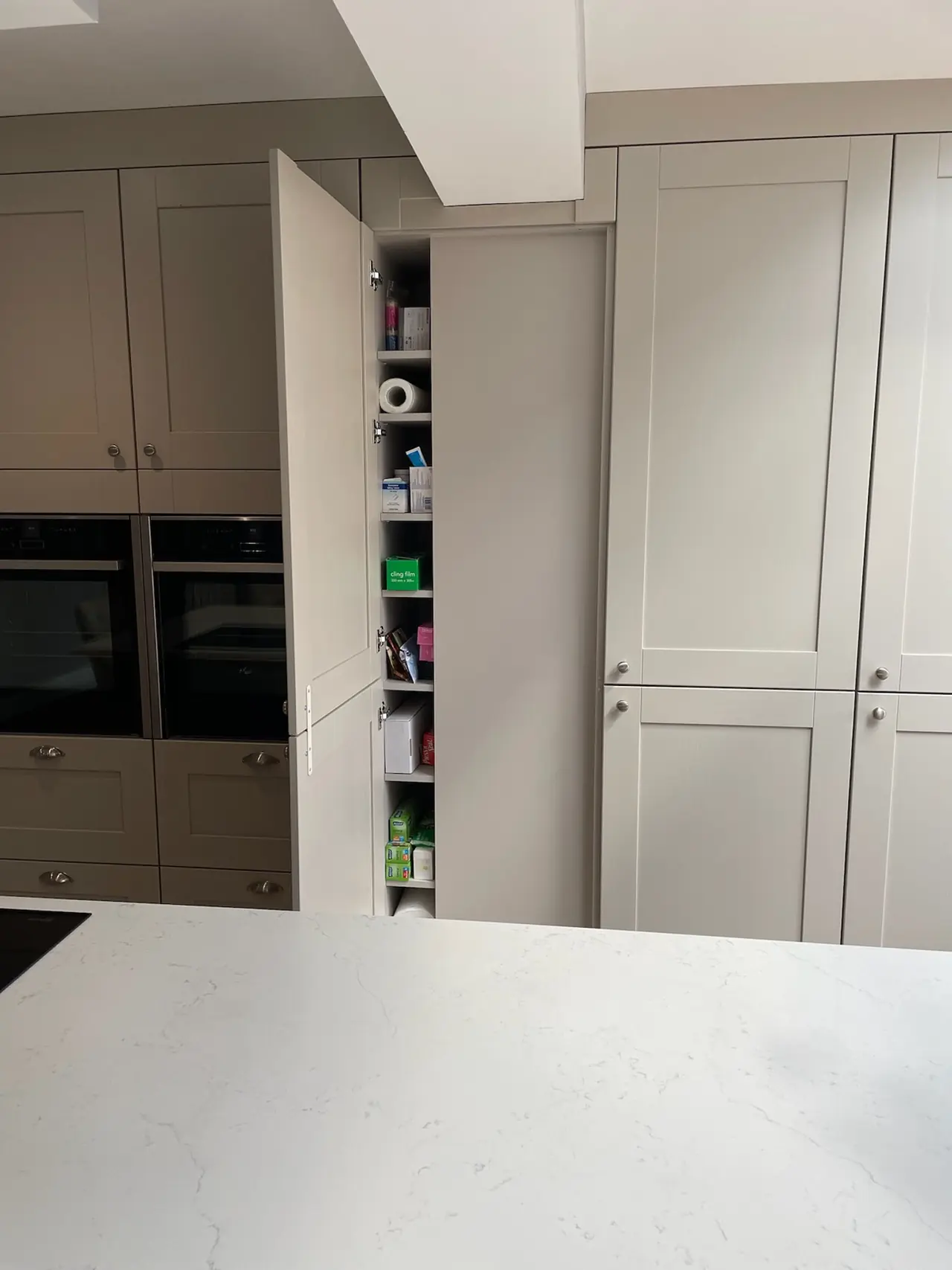 Pantry tall larder unit open door taupe, made and fitted by Sussex Design Interiors