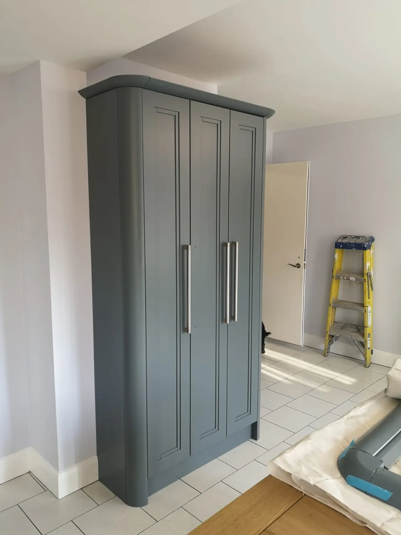 Wardrobe charcoal blue hinged doors construction, made and fitted by Sussex Design Interiors