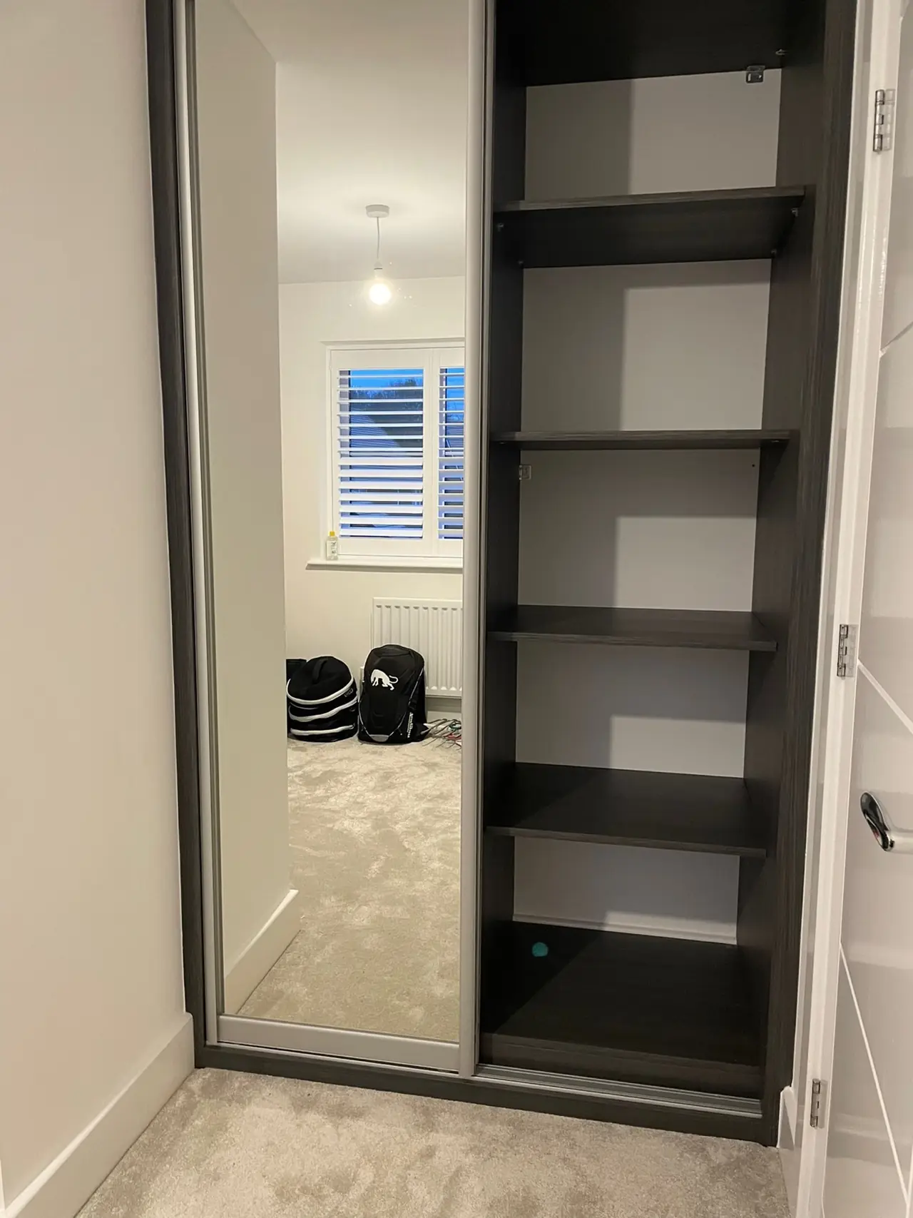 Wardrobe charcoal mirror sliding open shelves hallway, made and fitted by Sussex Design Interiors