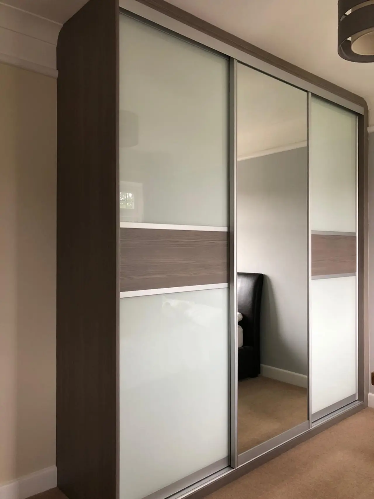 Wardrobe glass mirror sliding doors, made and fitted by Sussex Design Interiors
