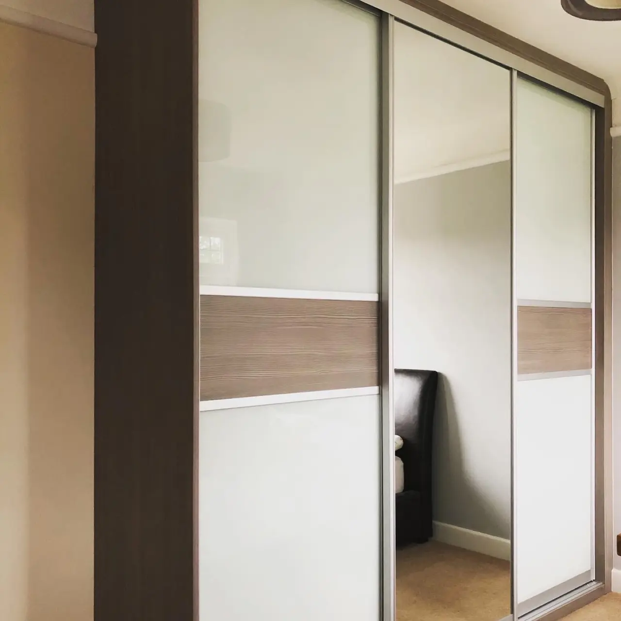 Wardrobe glass mirror sliding doors, made and fitted by Sussex Design Interiors