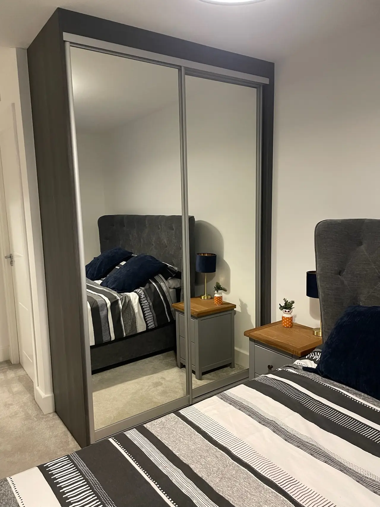 Wardrobe mirror sliding doors bedroom headboard, made and fitted by Sussex Design Interiors