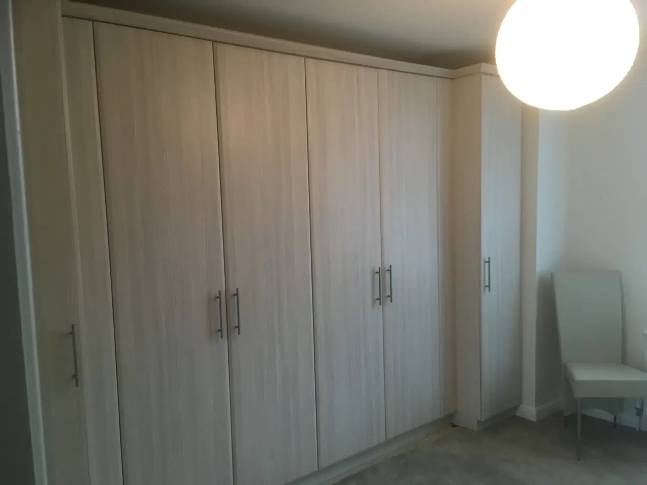 Wardrobe oak fitted hinged doors, made and fitted by Sussex Design Interiors