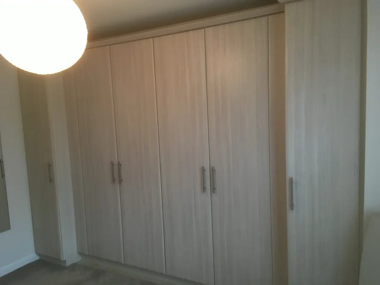 Wardrobe oak fitted hinged doors, made and fitted by Sussex Design Interiors